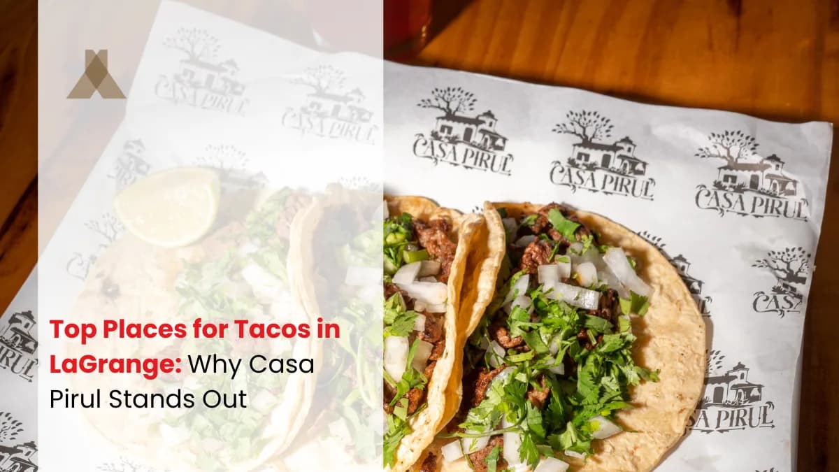 Two street tacos with onion and cilantro on Casa Pirul branded paper